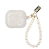 A white leopard pearl protective case for AirPods Pro attached to a pearl necklace.
