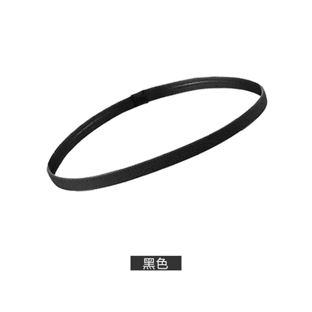 A black elastic silicone sports headband shown flat.