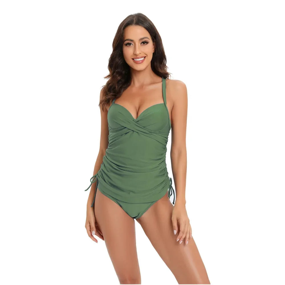 A woman models a green high-waisted two-piece swimsuit set.