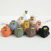 A collection of ten embroidered ankle socks in various pastel and earthy tones with rainbow hearts.