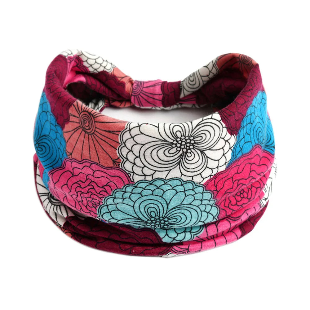 A colorful, patterned bohemian cotton stretch headband featuring floral and mandala designs.
