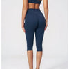A woman models a navy blue women's premium fitness tracksuit, showing full-length shots of the top and leggings.