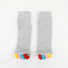 A pair of gray knitted five-finger yoga socks with colorful toe tips