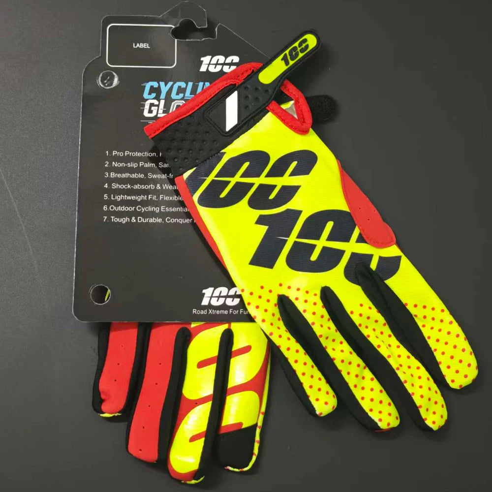 A pair of bright yellow and black cycling gloves with red accents are displayed next to their packaging.