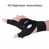 A hand wearing a black tactical glove with a button battery is shown.