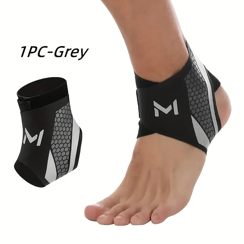 A black and grey adjustable ankle compression strap worn on a foot.