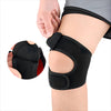 A black adjustable knee brace is shown being applied to a person's leg.