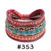 A colorful, patterned boho knotted cotton headband featuring geometric designs in red, orange, and teal.
