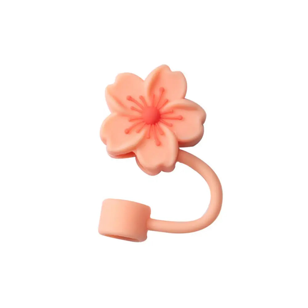 A pink silicone butterfly straw cover for tumblers.
