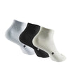 A set of three performance ankle socks in white, black, and off-white are displayed lying flat.