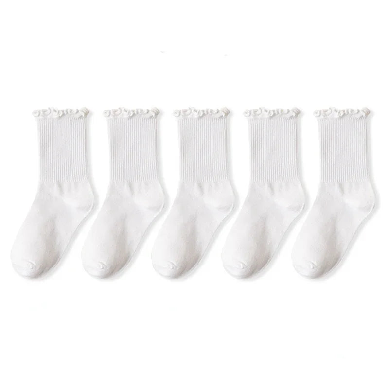 A pack of three white cotton ruffle ankle socks displayed side by side.