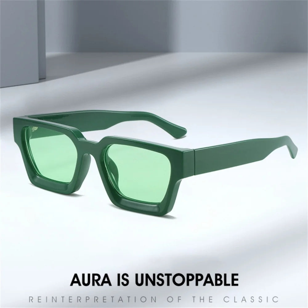 A pair of green retro square frame sunglasses with a classic design shown on a white surface.