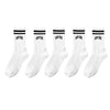 A set of white crew socks with black stripes and New York lettering.