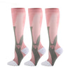 A set of three pink compression socks with gray and white accents shown standing vertically.