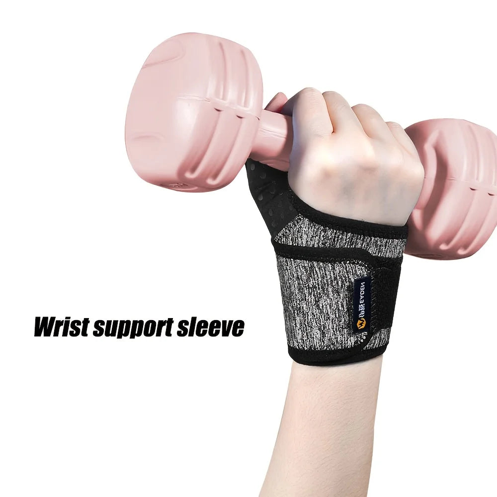 A hand wearing a black wrist support sleeve is holding a pink dumbbell.