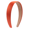 A pair of solid satin hair bands in a burnt orange color shown against a white background.