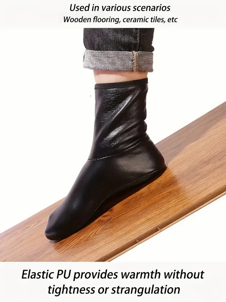 Black elastic PU boots worn on a wooden surface, demonstrating warmth without tightness.