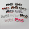 A collection of various square anti-blue light eyewear frames in different colors and styles.