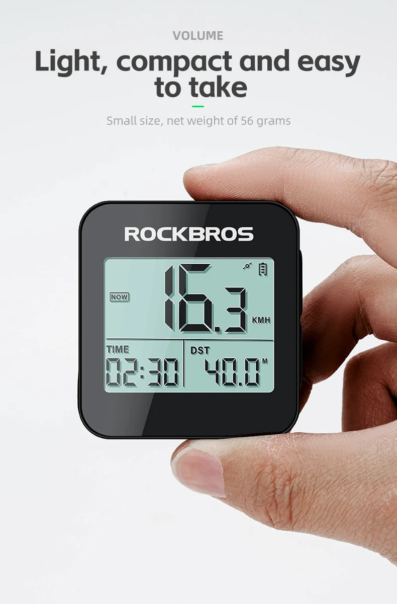 A hand holds a black Rockbros GPS cycling computer displaying a speed of 16.3 km/h and time.