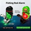 Two clip-on fishing rod alarms, one black and one green, featuring LED flash and buzzer alert for bites at night.