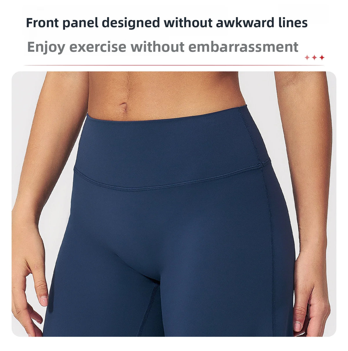 A close-up of a navy blue high-waist yoga legging worn by a person, highlighting the smooth front panel design.