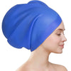 A bright blue silicone swimming cap is shown on a person's head, viewed from the side.