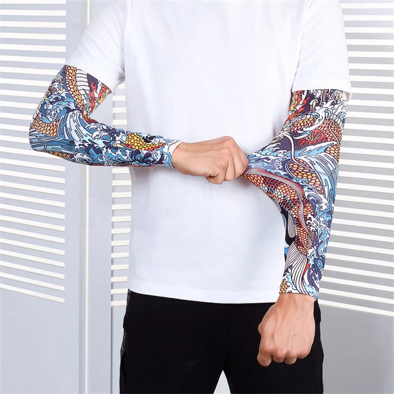 A person wearing a white shirt and black pants with patterned, long-sleeved sports arm sleeves.