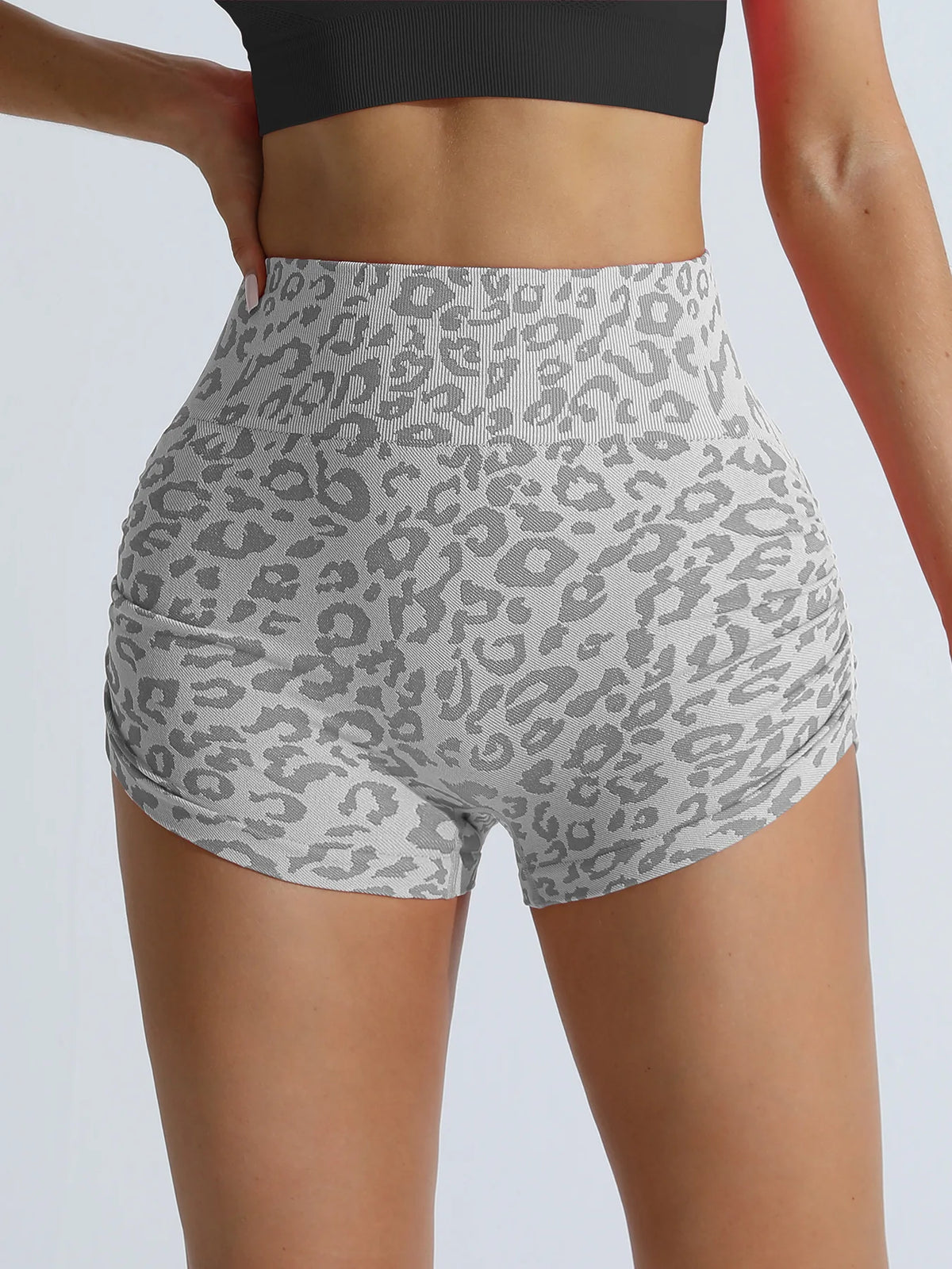 Gray leopard print high-waist seamless shorts worn by a model.