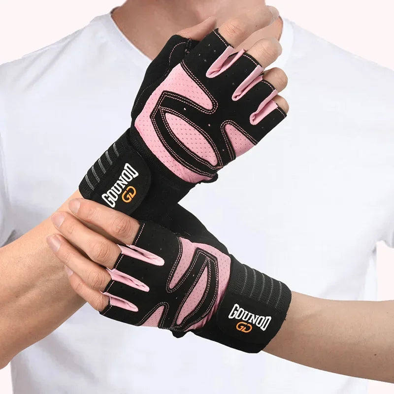 A person is wearing black and pink anti-slip weightlifting hand protection gloves on their hand.