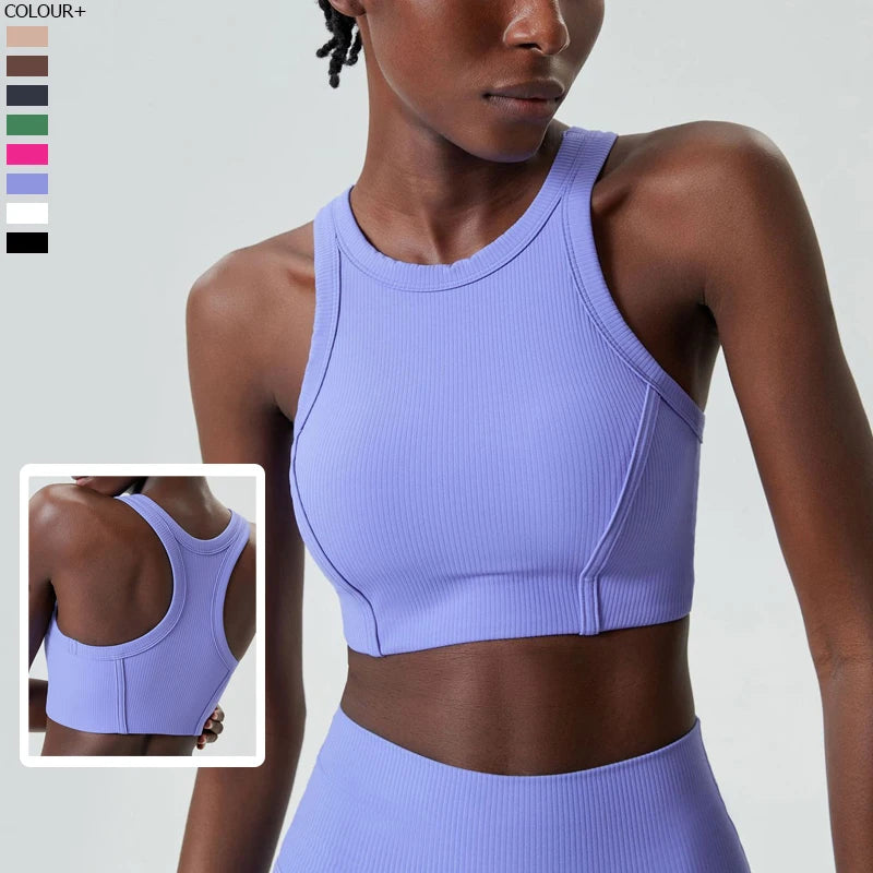 A model wears a light purple ribbed high-impact stretch yoga crop top and matching bottoms.