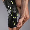 A close-up of a black performance knee compression sleeve worn on a person's leg.