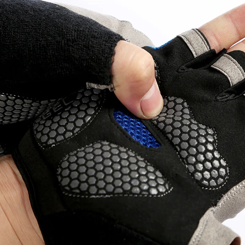 A hand wearing black and gray breathable anti-slip gym workout gloves.