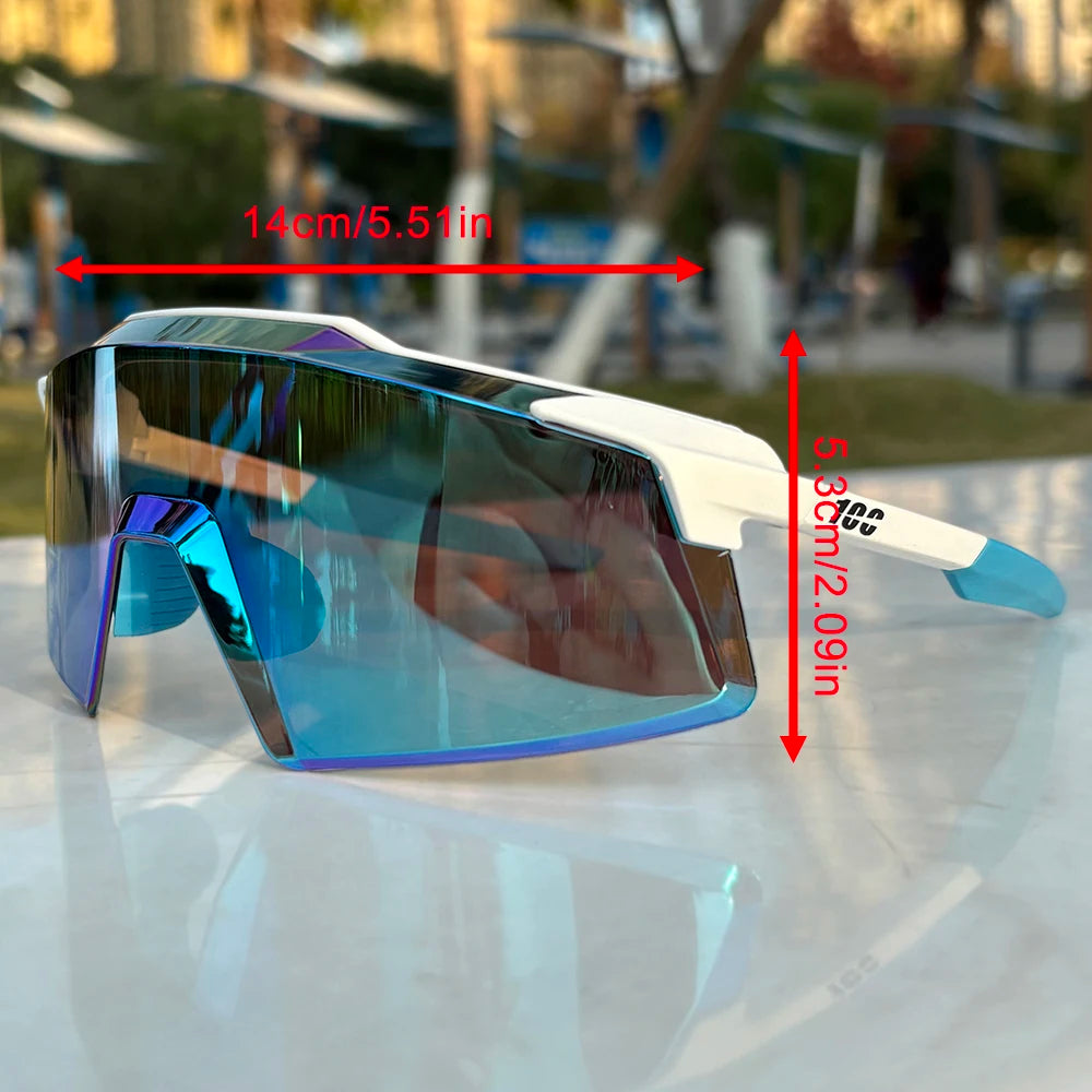 A pair of blue-tinted sports sunglasses resting on a white surface.