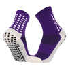 Purple and white performance sports grip socks shown from the side.