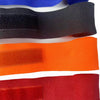 A collection of various colored boxing hand wraps laid out horizontally.