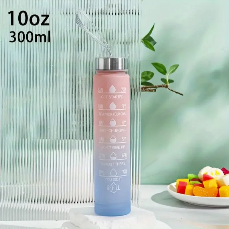 A tall, translucent pink water bottle with a silver cap and straw is shown against a light green background.