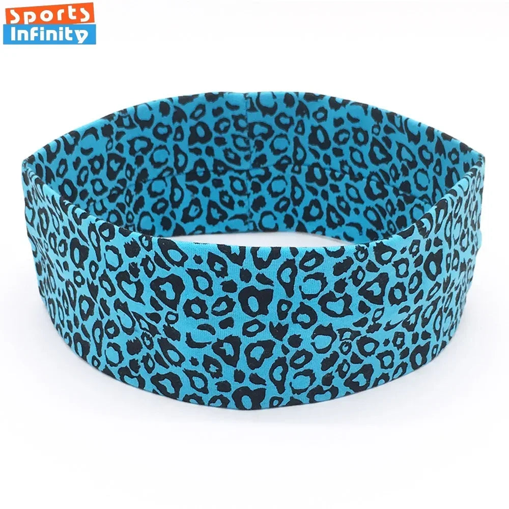 A black and teal leopard print women's sports headband shown flat.