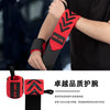 A person is wearing a red and black wrist support wrap on their arm.