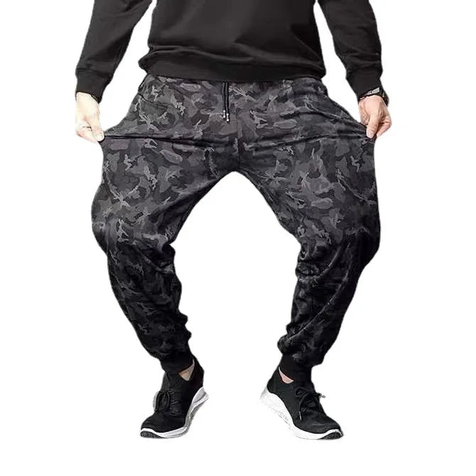 Men's camouflage elastic waist drawstring pants shown from the front view.