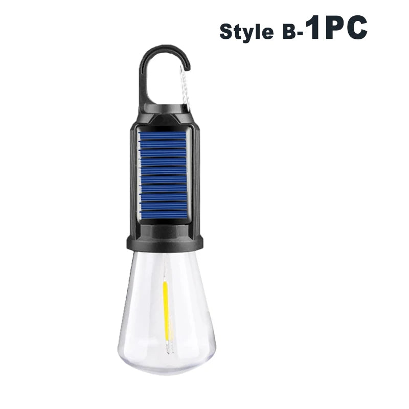 A black and blue USB rechargeable LED camping lantern with a clear glass bulb.