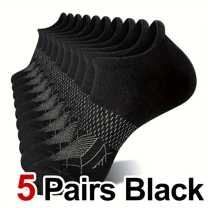 Five pairs of black performance compression ankle socks stacked and displayed.