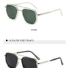 Silver clear/green sunglasses shown from the side view