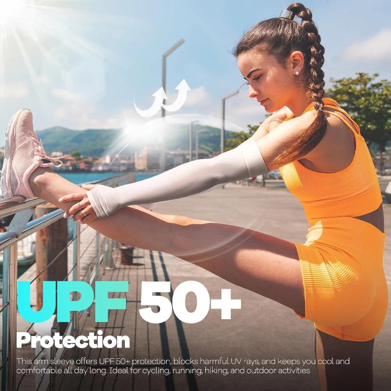 A woman wearing orange UPF 50+ arm sleeves is exercising outdoors with bright sunlight.
