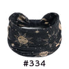 Black boho knotted cotton headband featuring celestial designs for yoga and workout.