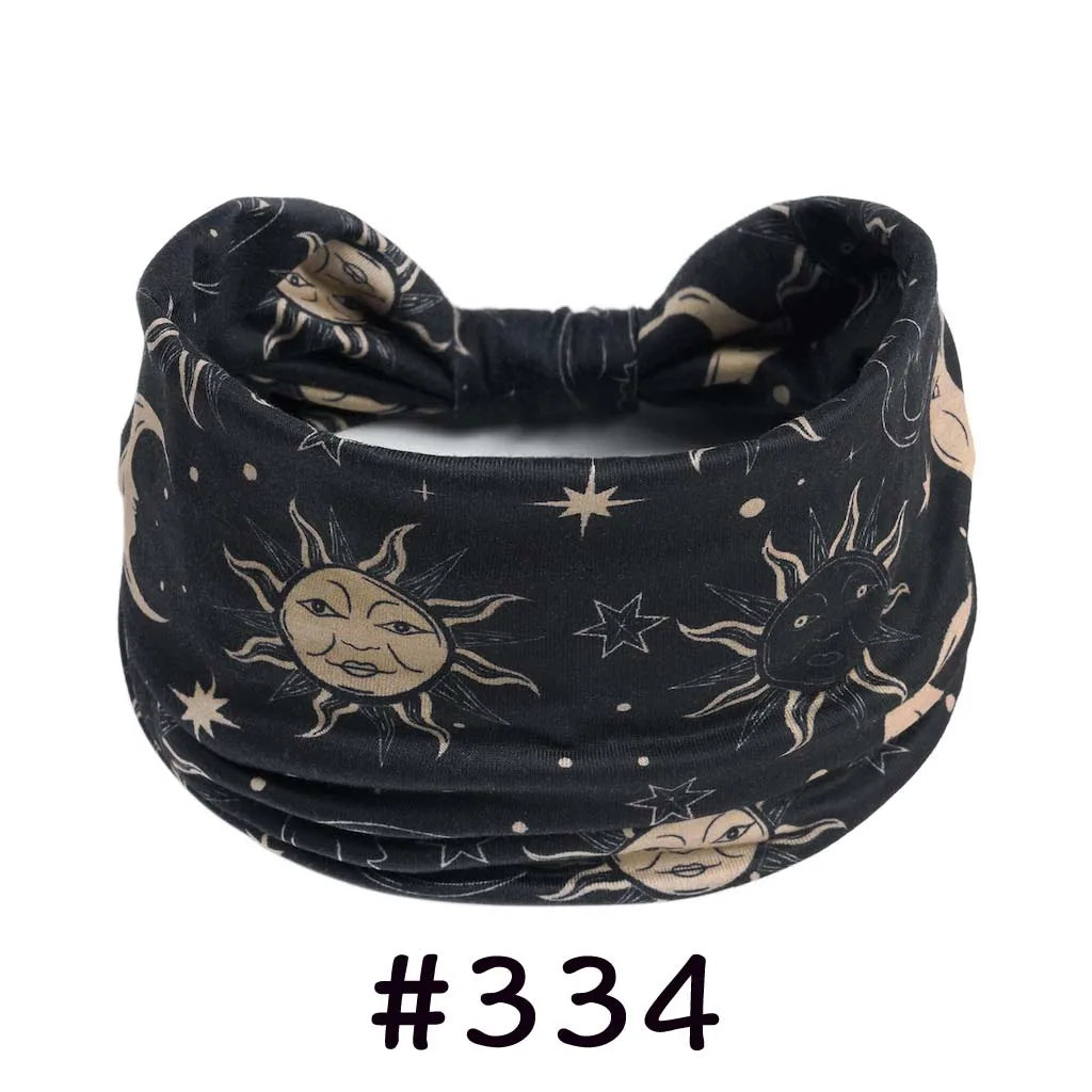 Black boho knotted cotton headband featuring celestial designs for yoga and workout.