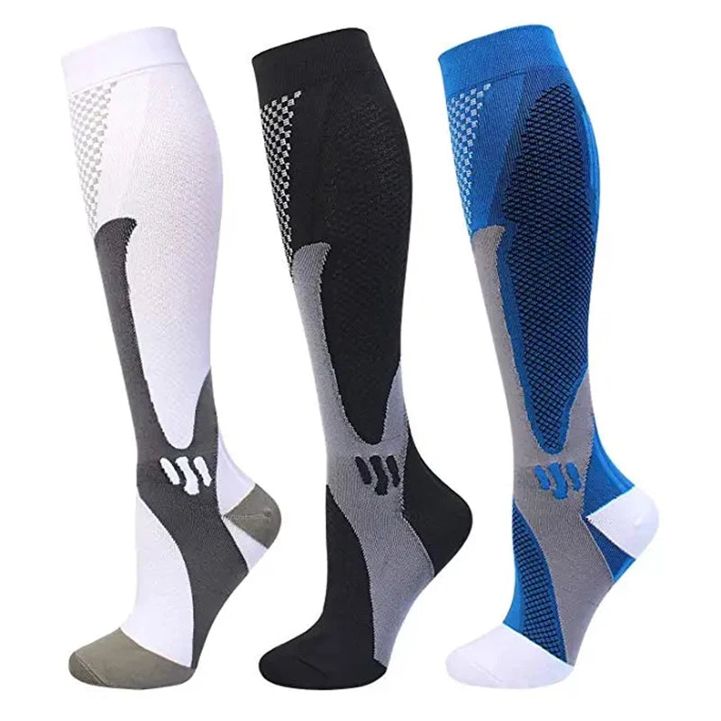 Three pairs of compression socks in white, black, and blue for circulation and recovery