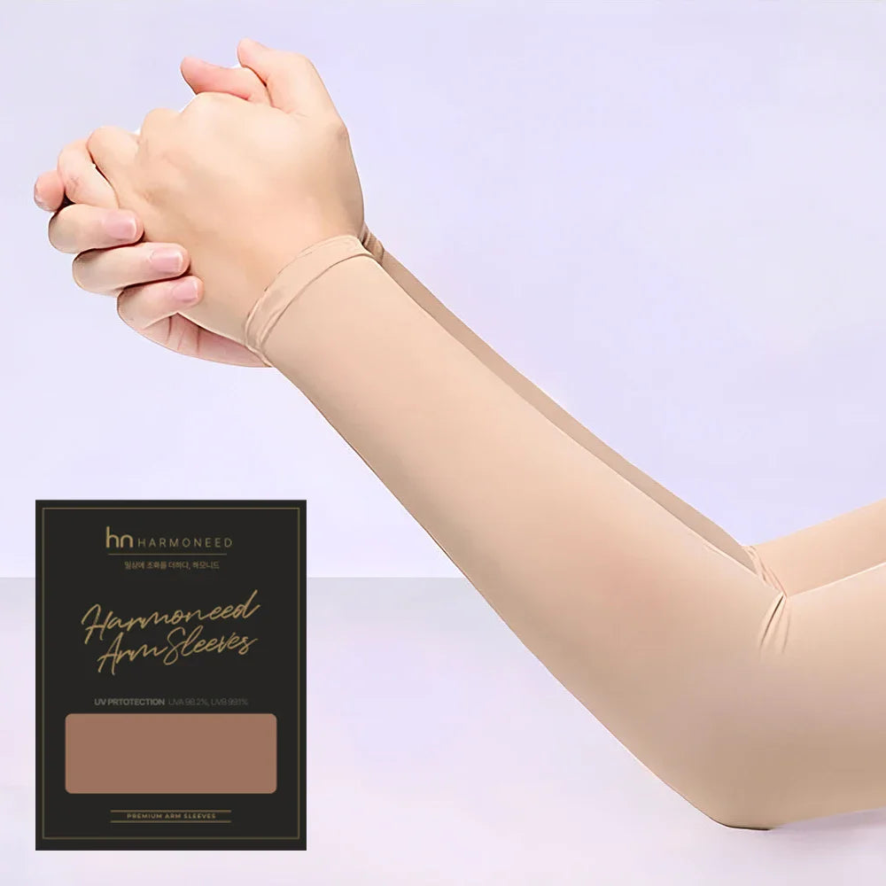 A person is wearing beige harmonized arm sleeves, demonstrating the fit and coverage for UV protection.
