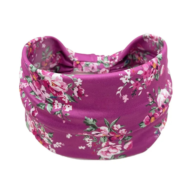 A purple floral butterfly headband for fitness.