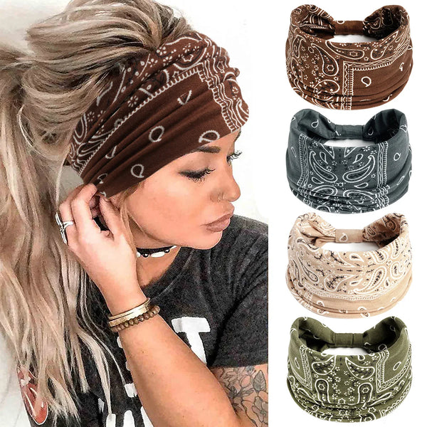 A woman wearing a brown bohemian cotton stretch headband and several other patterned headbands.