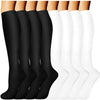 A display of black and white compression socks for vein support, shown from the ankle up.